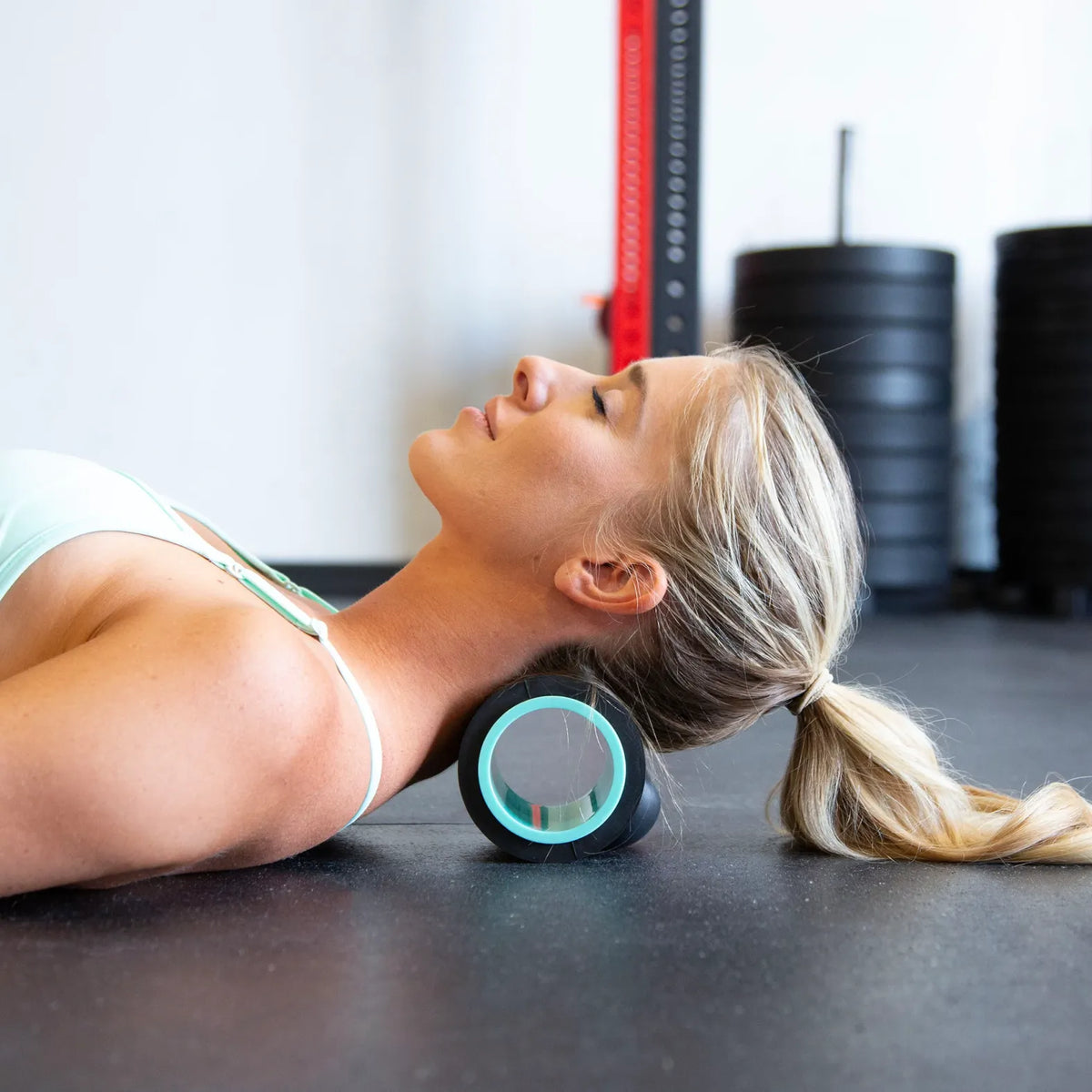 Person using the Chirp Wheel XR 4 Inch for neck tension and headache relief
