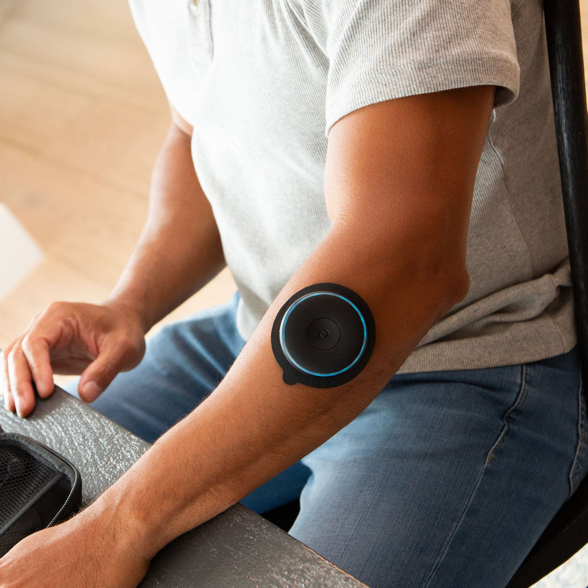 Person wearing Chirp Halo™ Trigger Point Pad Set on their arm