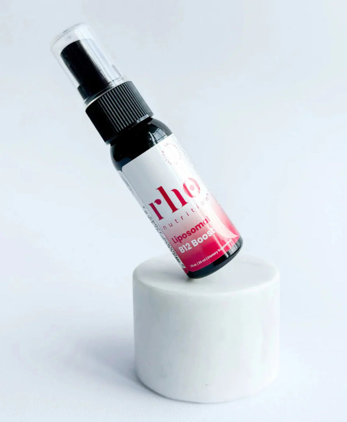Rho Nutrition Liposomal Methyl B12 spray bottle on display pedestal