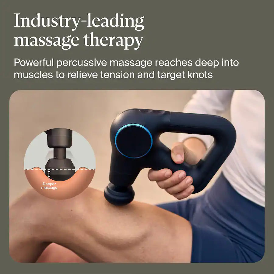 Person using a handheld massage device on their leg