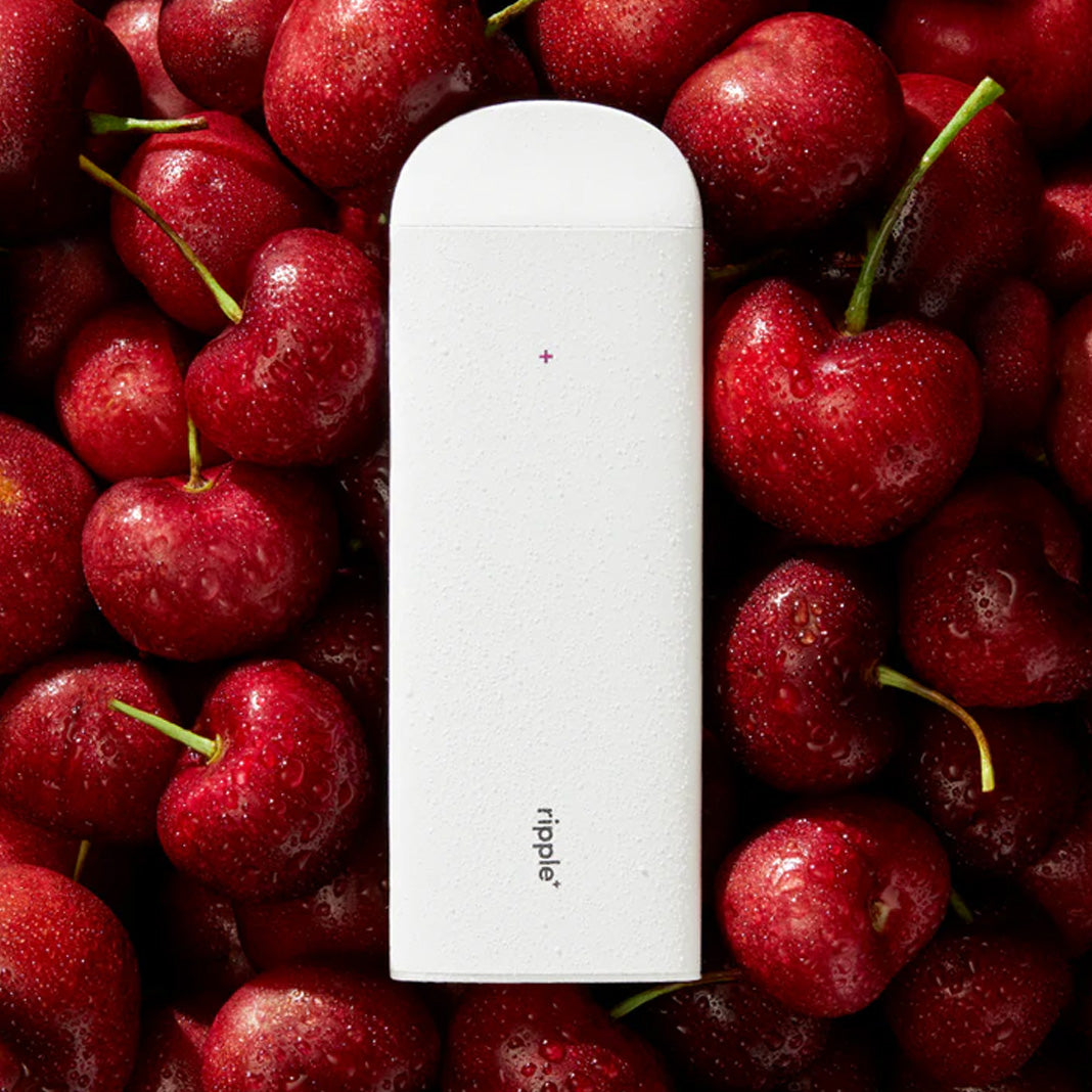 Ripple Burst cherry aroma vape device with fresh cherry background