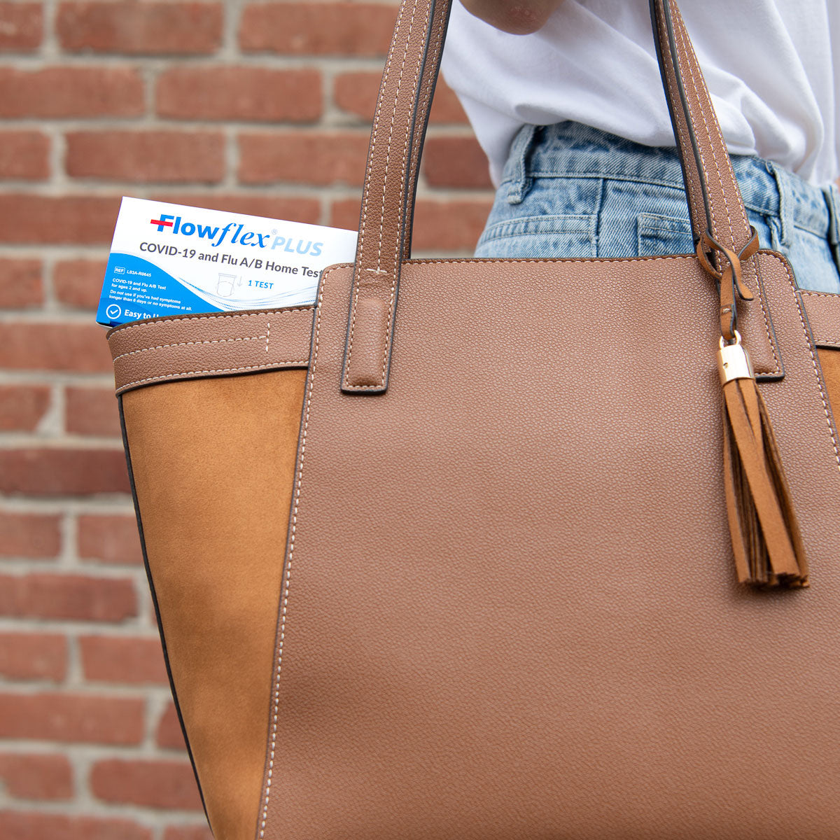 Flowflex Plus home test kit stored in handbag
