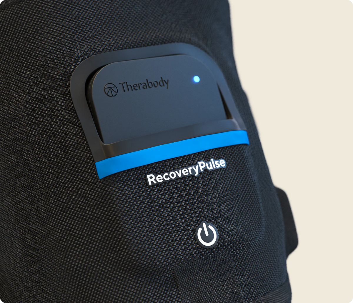Close-up of Therabody RecoveryPulse Arm device controls and settings