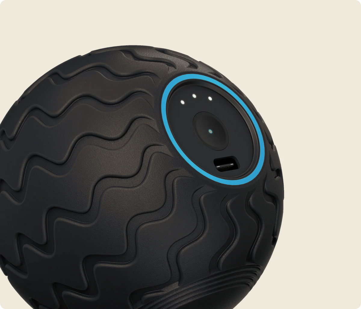 Close-up of Therabody WaveSolo vibrating massage ball with textured surface
