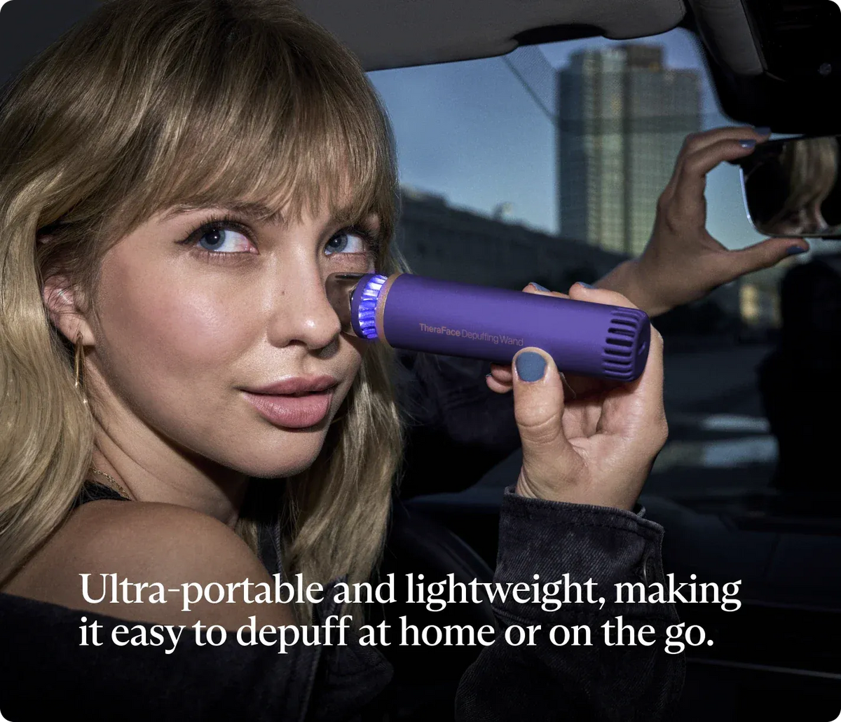 Woman using Therabody TheraFace Depuffing Wand (Indigo)