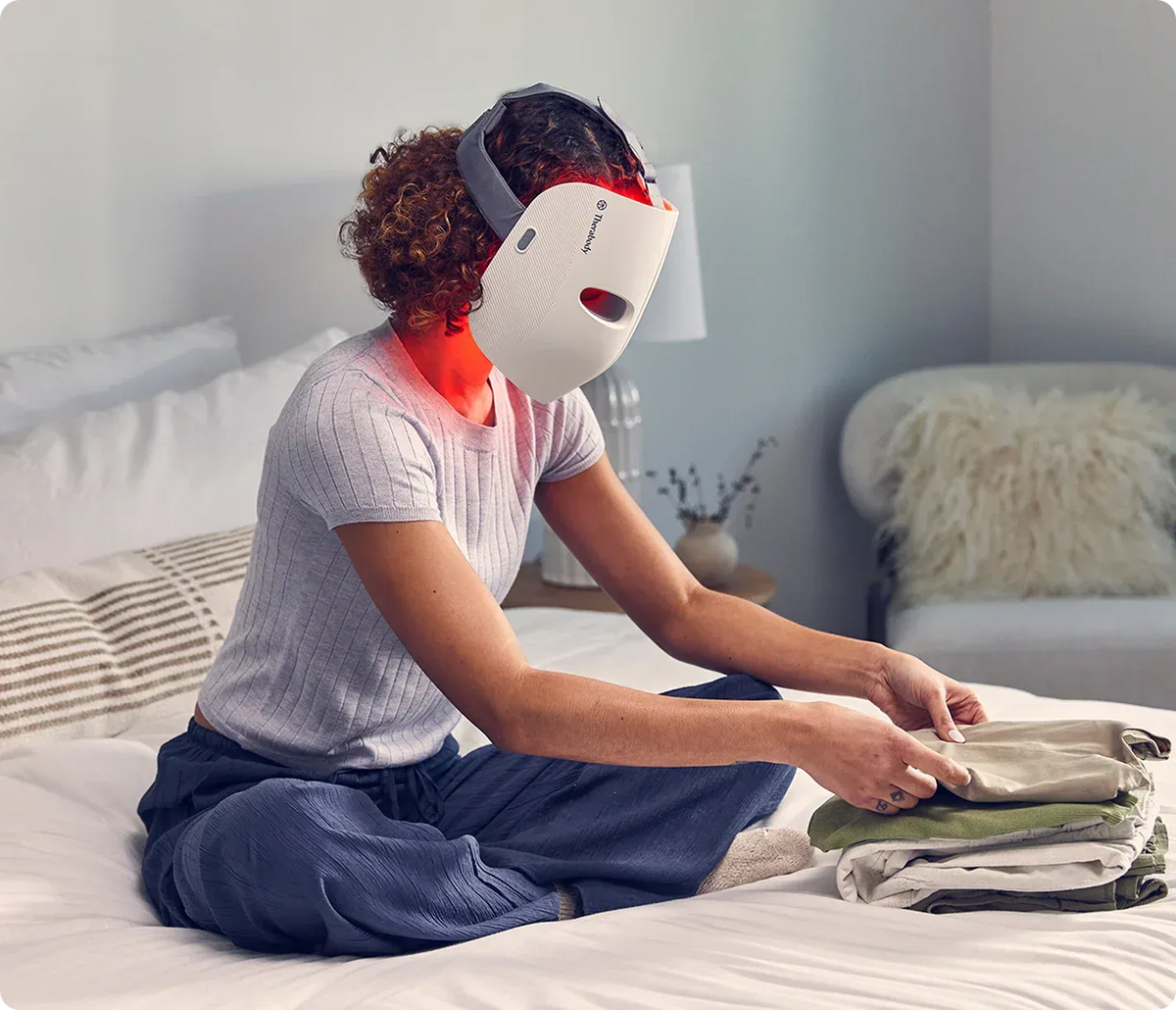 Women wearing Therabody TheraFace Mask during an at-home skincare routine