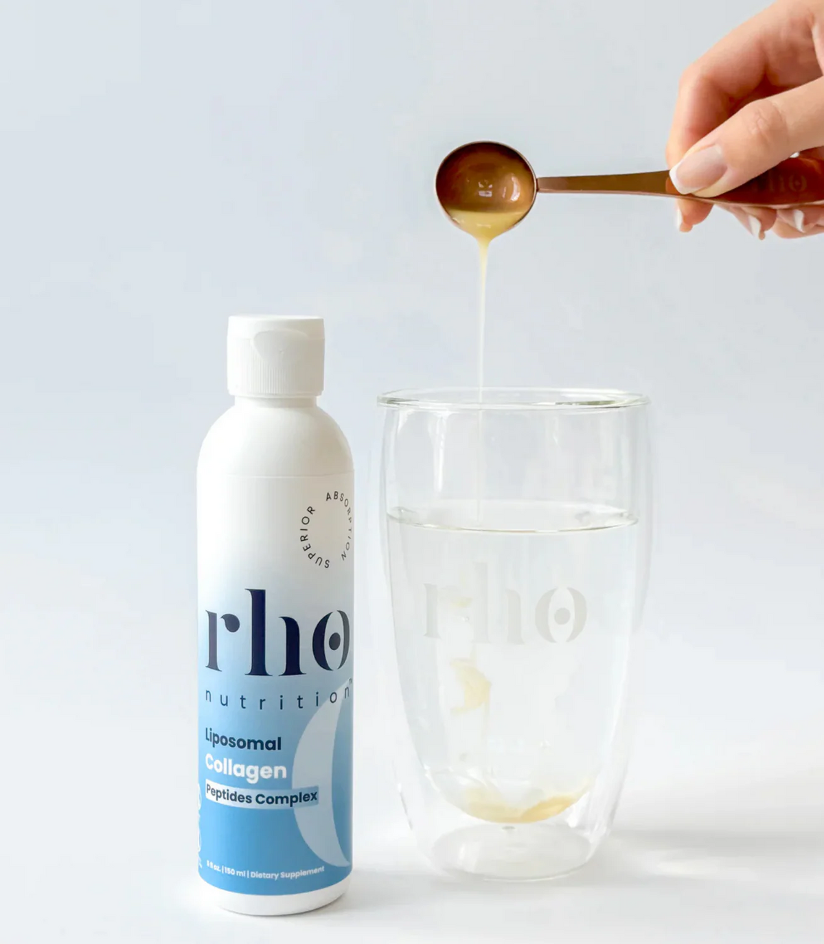 Mixing Rho Nutrition Liposomal Collagen Peptides into water with measuring spoon