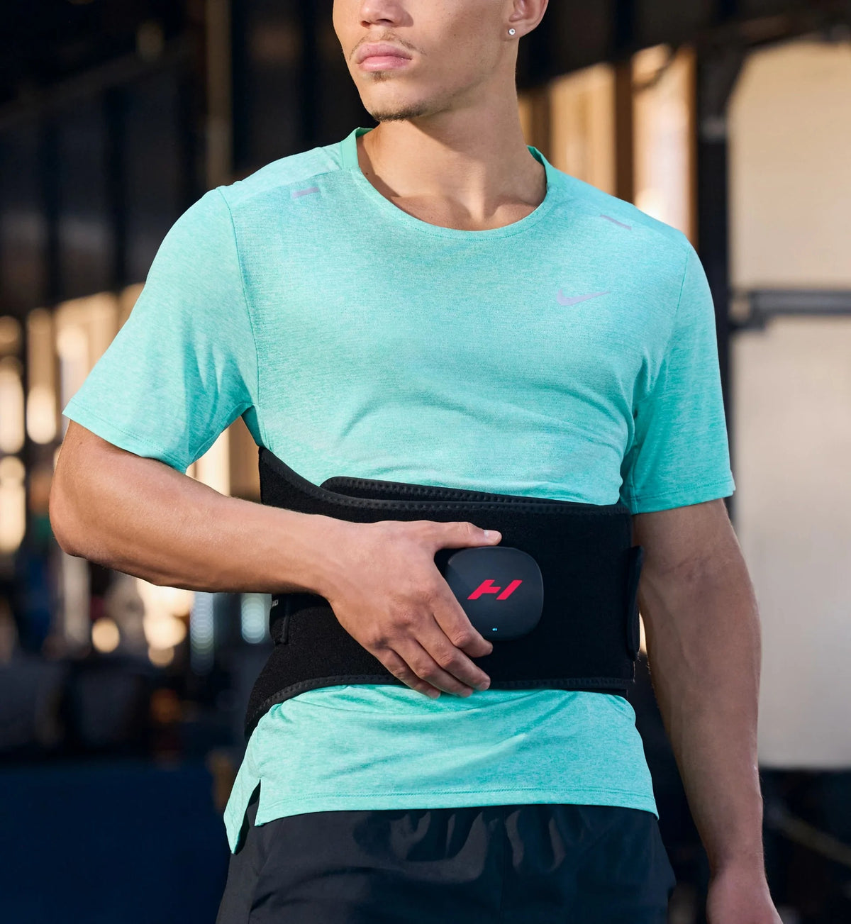 Man wearing Hyperice Venom 2 Back Heated Massage Wrap around his waist