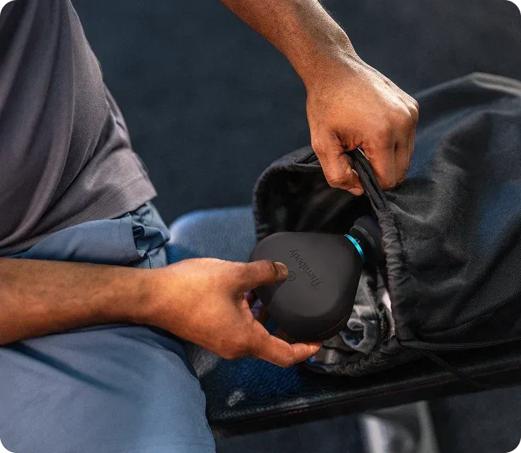 Therabody Theragun Mini stored in travel bag for portable recovery