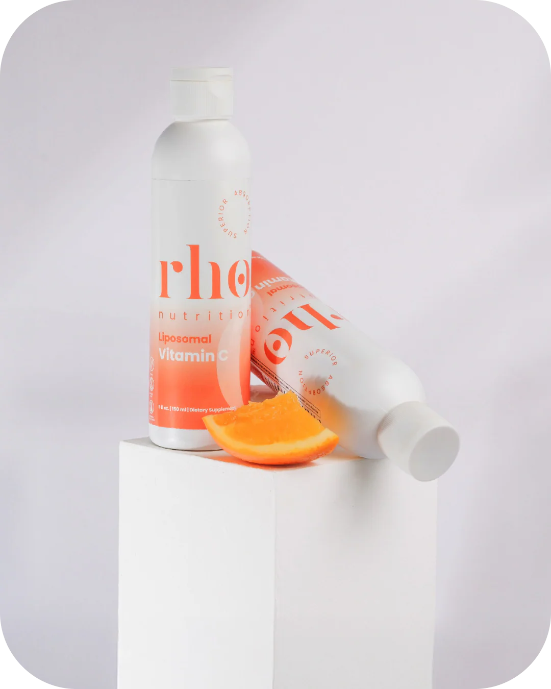 Rho Nutrition Liposomal Vitamin C bottle with fresh orange slices