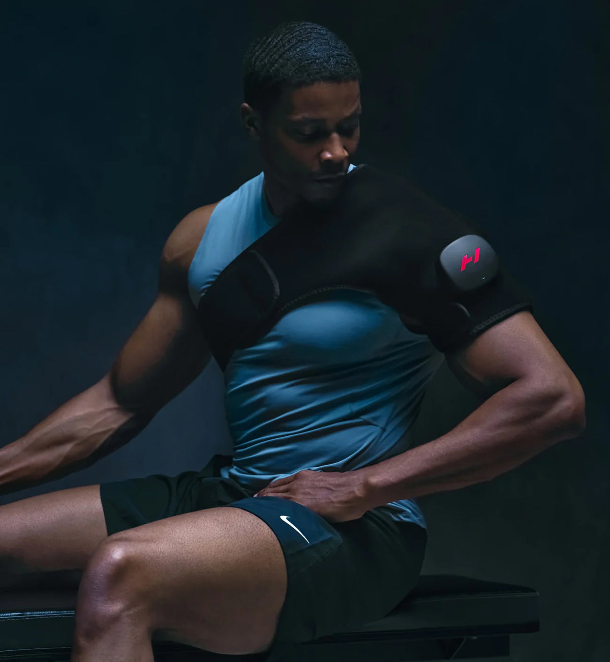 Man using a shoulder Hyperice Venom 2 on shoulder