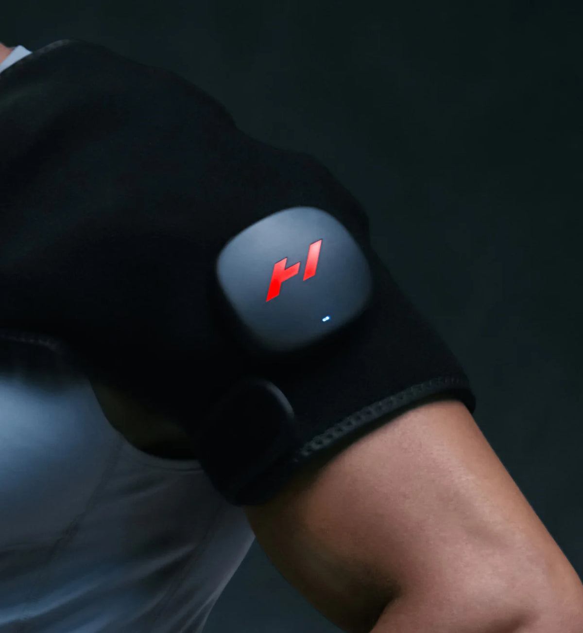 Person using Hyperice Venom 2 shoulder recovery wrap