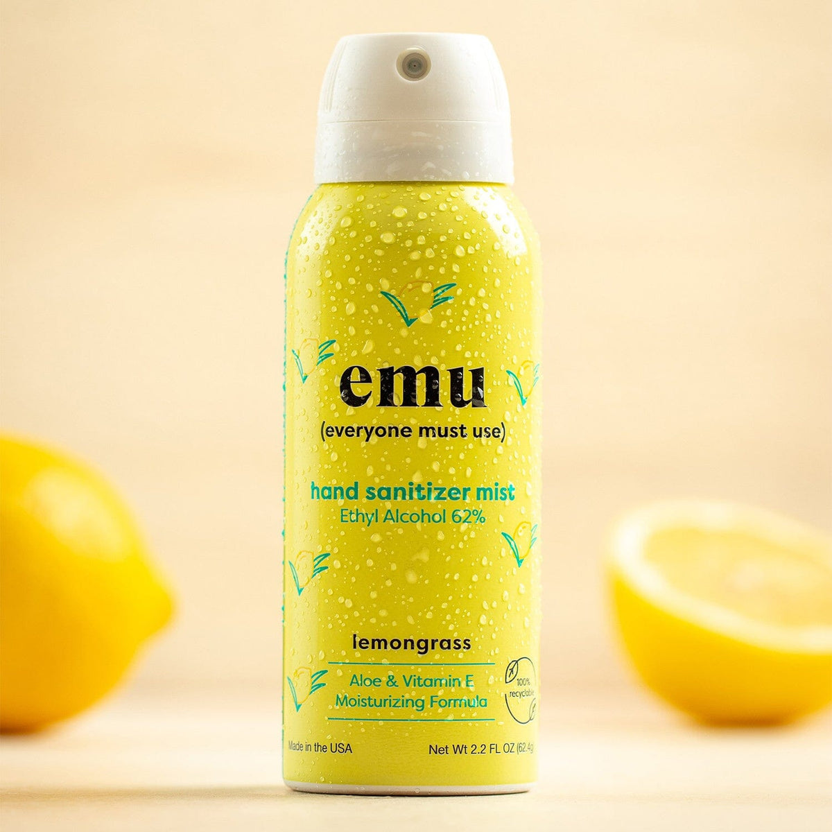 EMU lemon scented hand sanitizer spray with citrus background
